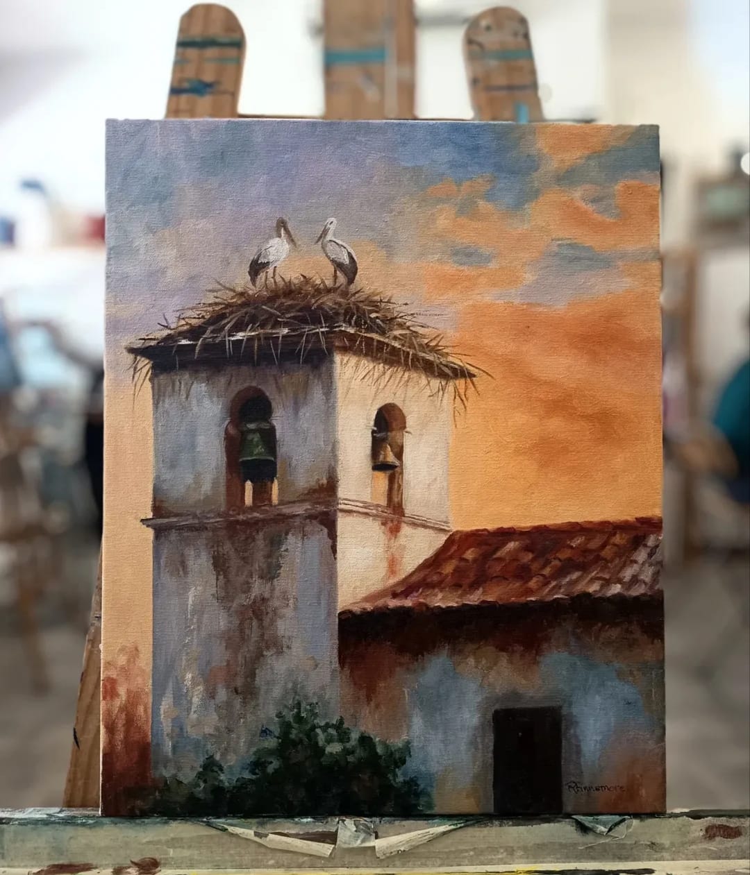 Pintura al óleo de campanario con cigüeñas